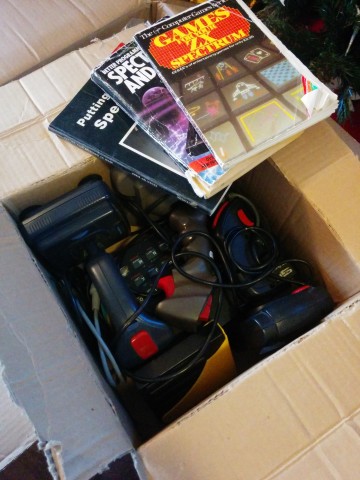 Inside this box we have some ZX Spectrum books, three joysticks, some disks, two 48k Spectrums, and an Interface 1
